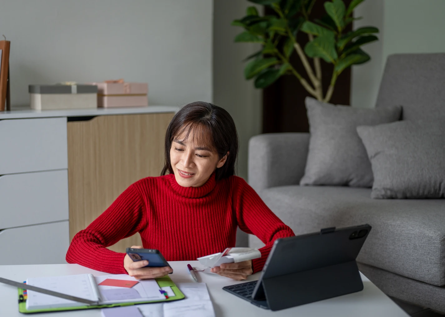 Woman working at home with tablet
