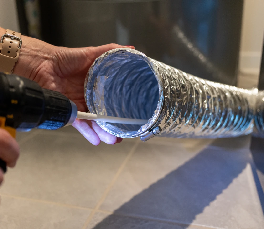 Air duct cleaning with vacuum hose